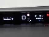 a close up of a car dashboard with a clock on it