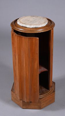 a small wooden table with a marble top on it