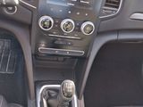 the interior of a car with a gear box and dashboard controls