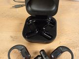 an image of a pair of headphones sitting on top of a wooden table