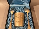 a silverware set in a blue box with a spoon and fork