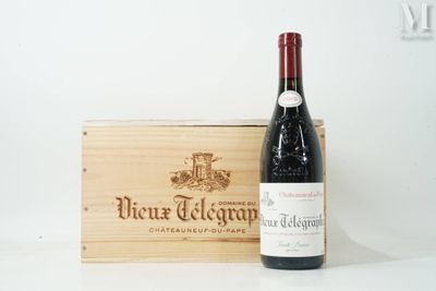 a bottle of wine that is sitting next to a wooden box