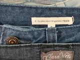 three pairs of blue jeans with a label on the back of them