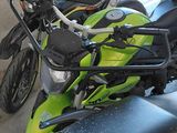 many motorcycles parked next to each other in a parking lot