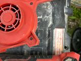 a red blower sitting on top of a black box