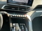 a car dashboard with a digital display and a steering wheel