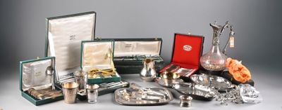 a lot of silver items that are on the table