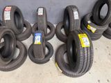 several tires are stacked on top of each other in a garage