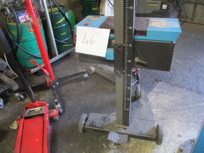 a picture of a garage with a lot of tools on the floor