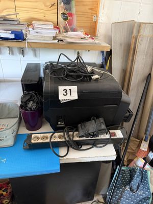 a black suitcase sitting on top of a blue table