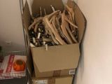 a cardboard box full of wood sticks in a room