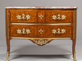 an antique chest of drawers with marble top and brass handles