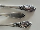 three spoons that are sitting on a white plate