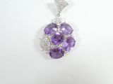 an amethorate and diamond pendant on a white background