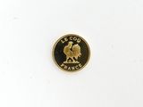 the coin is gold and has a rooster on it