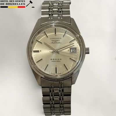 an image of a wrist watch with a silver dial on a white background