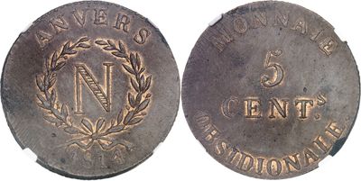 a close up of a coin on a white surface