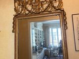 a mirror that is on the wall in the room
