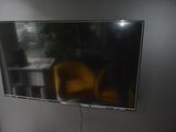 a flat screen tv hanging on the wall in a room