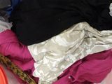 a pile of clothes that is sitting on a table