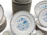 a lot of plates and cups on the table