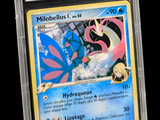 a close up of a pokemon card in a plastic case