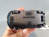 a person holding a remote control in their hand