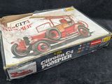 a box with a picture of an old fire truck in it