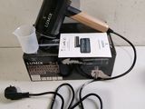 a picture of a hair dryer sitting on top of a box