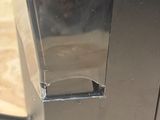 a close up of a microwave on a wooden table