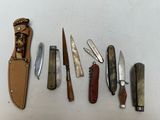 a lot of different types of knives on the table