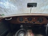 a dashboard of a car with a lot of gauges on it