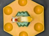 a yellow plate with a piece of cheese on it