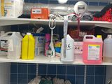 a washer and dryer on a shelf in a bathroom