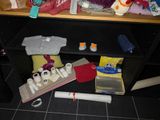 a picture of a cluttered desk with various items on it