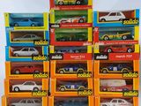 a lot of different model cars in the boxes