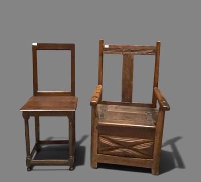 two wooden chairs sitting next to each other on a gray surface