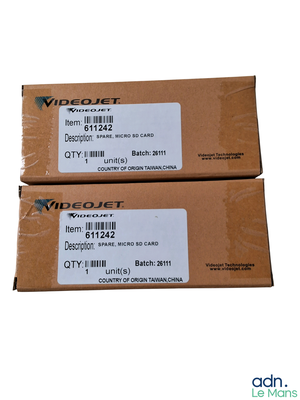 pair of two boxes with labels on them sitting on a white surface