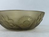 a glass bowl that has a flower design on it