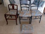 four chairs that are sitting in front of a couch
