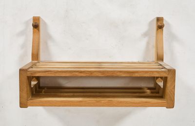 a wooden shelf with a shelf attached to it