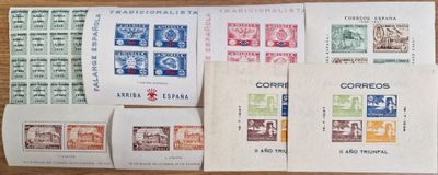 many different types of stamps on a wooden table