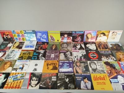 a table with a lot of different album covers on it