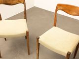 pair of mid century danish teak dining chairs with cream upholstered seats