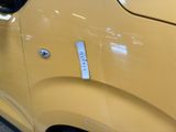 a close up of a car door with a sticker on it