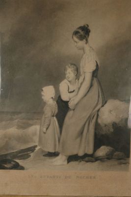 une vieille photo représentant une femme et deux enfants sur la plage