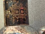 a silver vase with a number on it sitting on a table