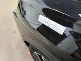 a sticker on the back of a black car