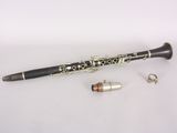 a black and white clarinet with a silver and black case