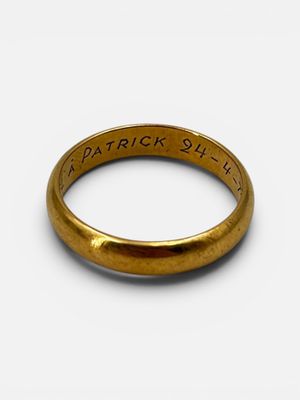 a close up of a gold ring with the words patrick street engraved on it